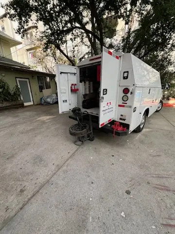 Magnet Plumbing service vehicle on-site for Grease Trap Cleaning in Boxboro Station